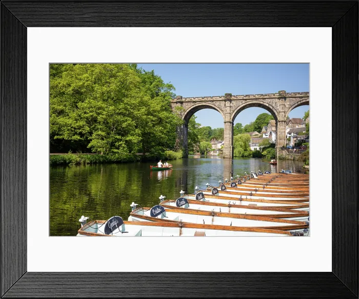 Framed Print : People rowing past boats for hire in front of the Railway Viaduct over the river Nidd in Knaresborogh, Yorkshire, United Kingdom Framed Print : People rowing past boats for hire in front of the Railway Viaduct over the river Nidd in Knaresborogh, Yorkshire, United Kingdom