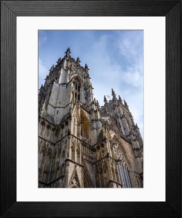 Framed Print : Looking up at the ornate facade and towers of York Minster in the ancient city of York, Yorkshire, United Kingdom Framed Print : Looking up at the ornate facade and towers of York Minster in the ancient city of York, Yorkshire, United Kingdom