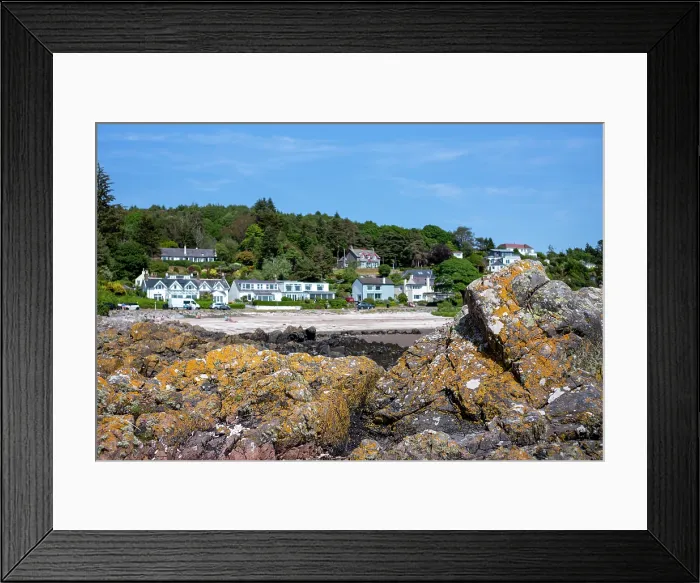 Framed Print : Row of houses facing the Rocky beach in Rockcliffe, United Kingdom Framed Print : Row of houses facing the Rocky beach in Rockcliffe, United Kingdom