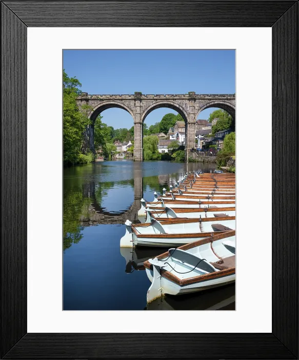 Framed Print : Row boats for hire in front of the Railway Viaduct over the river Nidd in Knaresborogh, Yorkshire, United Kingdom Framed Print : Row boats for hire in front of the Railway Viaduct over the river Nidd in Knaresborogh, Yorkshire, United Kingdom