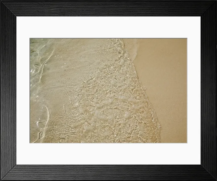 Framed Print : Pristine shallow waters lap against the white coral sand of a tropical beach; Havodda Island, Gaafu Dhaalu atoll, Maldives Framed Print : Pristine shallow waters lap against the white coral sand of a tropical beach; Havodda Island, Gaafu Dhaalu atoll, Maldives