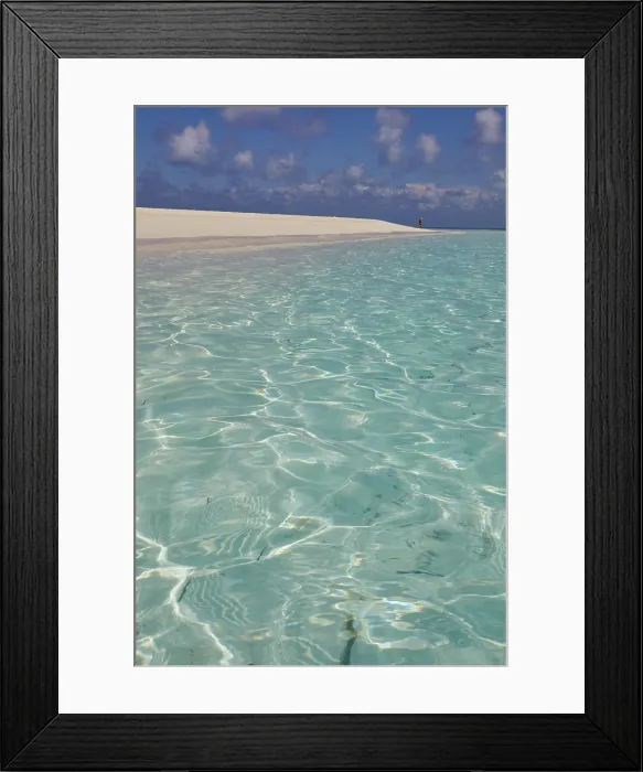 Framed Print : Pristine shallow waters lap against the white coral sand of a tropical beach; Havodda Island, Gaafu Dhaalu atoll, Maldives Framed Print : Pristine shallow waters lap against the white coral sand of a tropical beach; Havodda Island, Gaafu Dhaalu atoll, Maldives