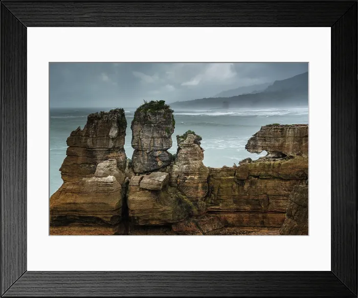 Framed Print : Twin Rock Formations at Pancake Rocks Against a Moody Sky in Punakaiki, Paparoa National Park, New Zealand Framed Print : Twin Rock Formations at Pancake Rocks Against a Moody Sky in Punakaiki, Paparoa National Park, New Zealand