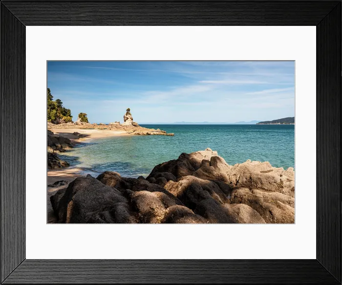 Framed Print : Famous Rock Tower on Rocky Shoreline Overlooking Turquoise Sea at Abel Tasman National Park, New Zealand Framed Print : Famous Rock Tower on Rocky Shoreline Overlooking Turquoise Sea at Abel Tasman National Park, New Zealand