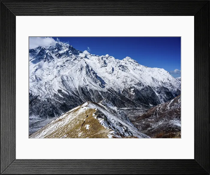 Framed Print : Aerial view of ridgeline leading toward rugged snow-covered mountains above Langtang Valley near Kyanjin Gompa, Nepal. Summit of Lower Kyanjn Ri Framed Print : Aerial view of ridgeline leading toward rugged snow-covered mountains above Langtang Valley near Kyanjin Gompa, Nepal. Summit of Lower Kyanjn Ri