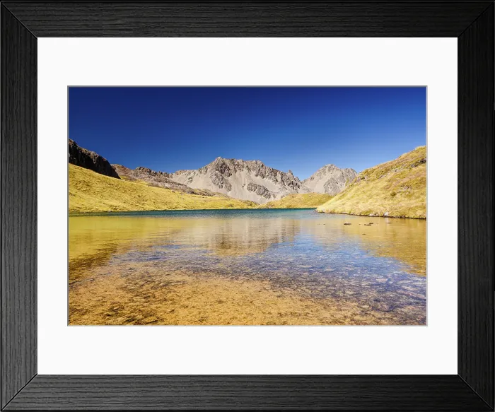 Framed Print : Peaceful wilderness lake beneath sunlit mountain range in natural reserve, Nelson Lakes National Park, New Zealand Framed Print : Peaceful wilderness lake beneath sunlit mountain range in natural reserve, Nelson Lakes National Park, New Zealand