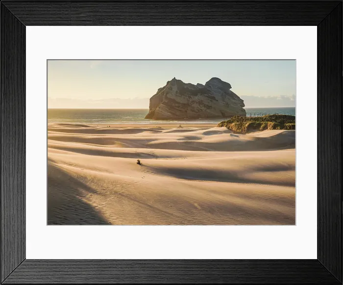 Framed Print : Solitary Walker Across Vast Dunes with Archway Island at Sunrise, Wharariki Beach, New Zealand