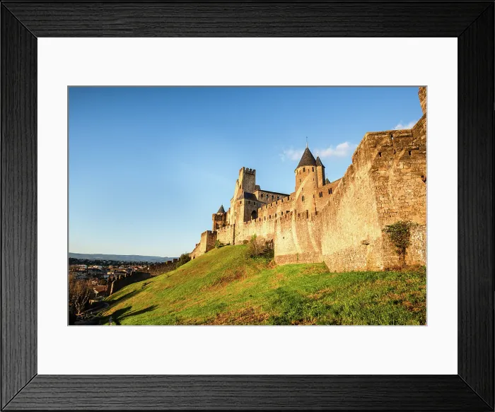 Framed Print : Green hilly slope and the stone fortification of the Medieval castle of Carcassonne, Languedoc-Roussillon, France Framed Print : Green hilly slope and the stone fortification of the Medieval castle of Carcassonne, Languedoc-Roussillon, France