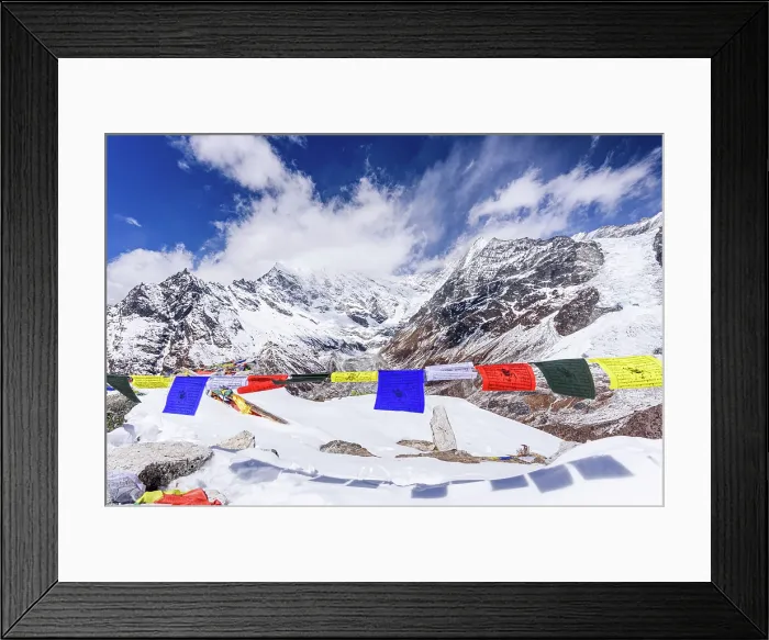 Framed Print : Colorful Tibetan Prayer Flags Fluttering on the Snowy Summit of Kyanjin Ri with Langtang Lirung Towering in the Background on a Clear Winter Day Framed Print : Colorful Tibetan Prayer Flags Fluttering on the Snowy Summit of Kyanjin Ri with Langtang Lirung Towering in the Background on a Clear Winter Day