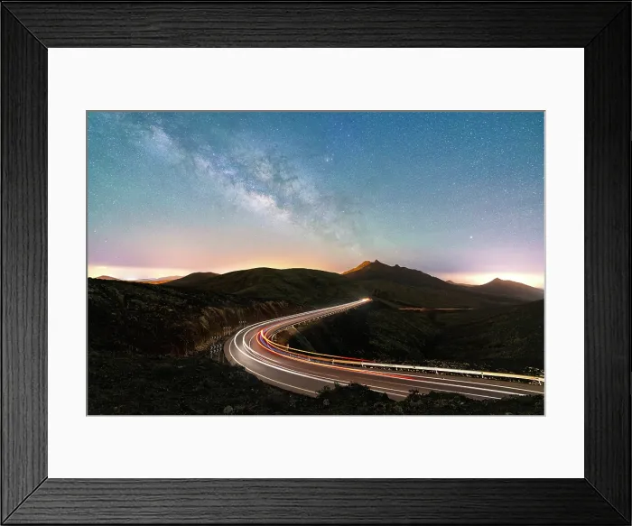 Framed Print : Milky Way glowing over the car trail lights on a winding desert road, Sicasumbre viewpoint, Fuerteventura, Canary Islands, Spain Framed Print : Milky Way glowing over the car trail lights on a winding desert road, Sicasumbre viewpoint, Fuerteventura, Canary Islands, Spain