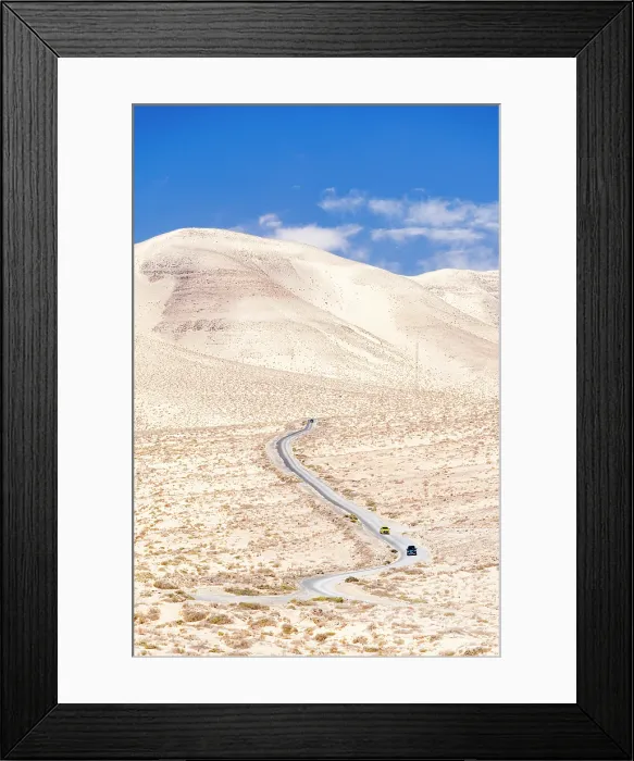 Framed Print : High angle view of cars driving on a winding desert road in the barren landscape, Jandia, Fuerteventura, Canary Islands, Spain Framed Print : High angle view of cars driving on a winding desert road in the barren landscape, Jandia, Fuerteventura, Canary Islands, Spain
