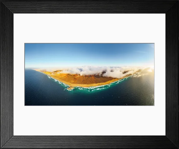 Framed Print : Aerial panoramic of golden sand of Cofete beach washed by the crystal sea, Jandia Natural Park, Fuerteventura, Canary Islands Framed Print : Aerial panoramic of golden sand of Cofete beach washed by the crystal sea, Jandia Natural Park, Fuerteventura, Canary Islands