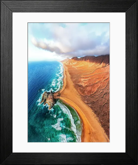 Framed Print : Aerial view of volcanic cliffs overlooking Cofete beach washed by waves, Jandia Nature Park, Fuerteventura, Canary Islands, Spain