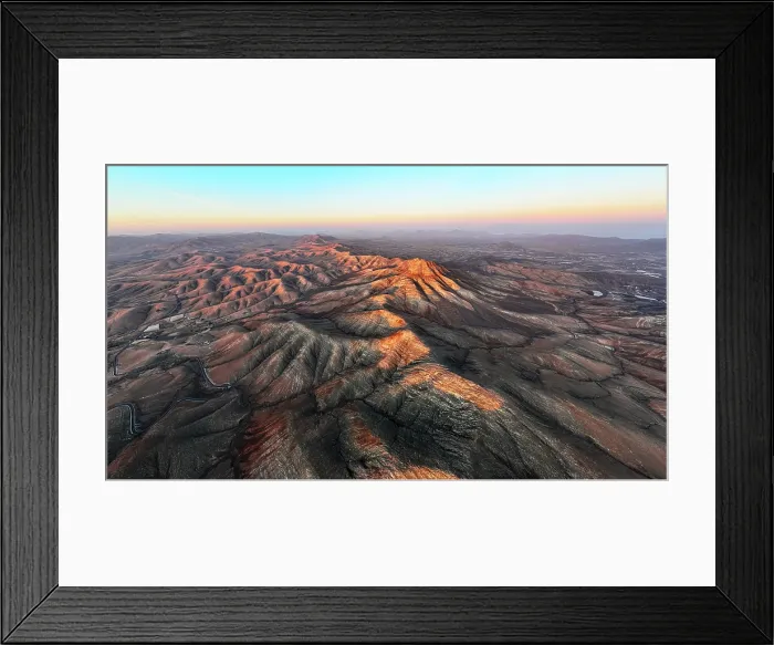 Framed Print : Aerial view of desert mountains and volcanic landscape at sunset from Sicasumbre viewpoint, Fuerteventura, Canary Islands, Spain Framed Print : Aerial view of desert mountains and volcanic landscape at sunset from Sicasumbre viewpoint, Fuerteventura, Canary Islands, Spain