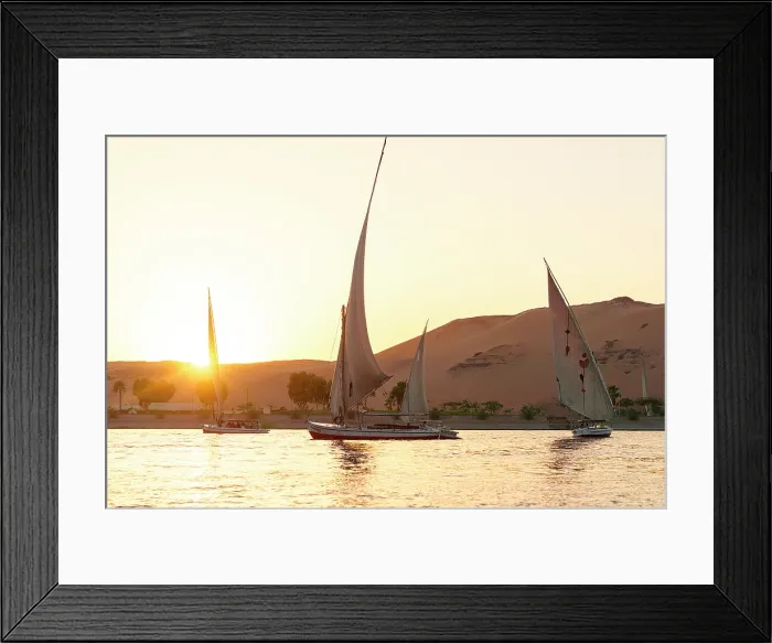 Framed Print : Felucca boats sailing in Nile River at sunset, Aswan, Egypt