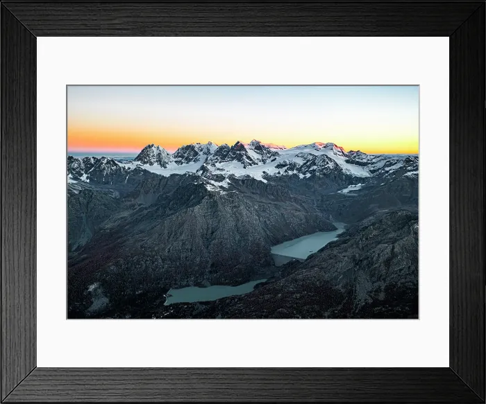 Framed Print : Aerial view of the snowy Bernina Range, Campo Moro dam and reservoir at sunrise in autumn, Valmalenco, Lombardy, Italy Framed Print : Aerial view of the snowy Bernina Range, Campo Moro dam and reservoir at sunrise in autumn, Valmalenco, Lombardy, Italy