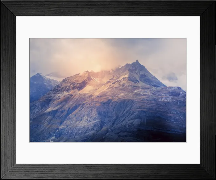Framed Print : Swiss Alps mountain peaks dramatic sunset view, cloudy sky in Switzerland Framed Print : Swiss Alps mountain peaks dramatic sunset view, cloudy sky in Switzerland