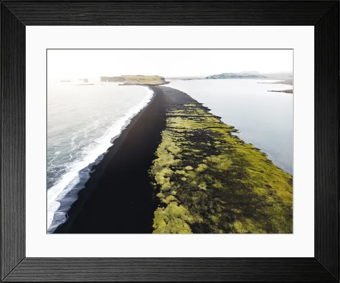 Framed Print : Volcanic Black Sand Beach with a view of Reynisdrangar. Waves crashing on the black sand beach. Vik, Iceland