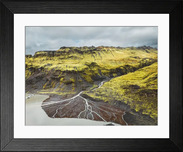 Framed Print : Aerial view of Icelandic riverbed flowing into the sea. River flowing through the volcanic landscape of Iceland