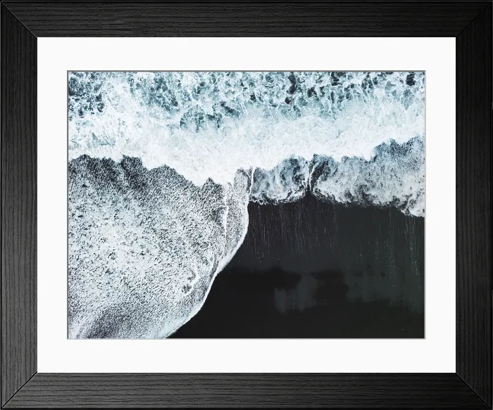 Framed Print : Volcanic Black Sand Beach with a view of Reynisdrangar. Waves crashing on the black sand beach. Vik, Iceland