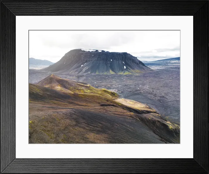 Framed Print : Remote volcanic lands somewhere in Iceland mainland, surrounded by vibrant green bushes and volcanic lands. Volcanic rock formations, small mountains, black grey volcanic rock Framed Print : Remote volcanic lands somewhere in Iceland mainland, surrounded by vibrant green bushes and volcanic lands. Volcanic rock formations, small mountains, black grey volcanic rock