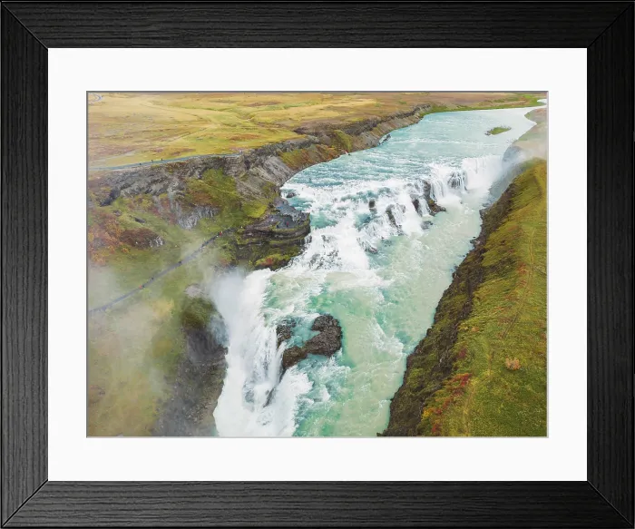 Framed Print : Huge beautiful waterfall Gullfoss, famous landmark in Iceland. River foaming whilst falling down the waterfall, tourist waling by, looking at the waterfall from a view point Framed Print : Huge beautiful waterfall Gullfoss, famous landmark in Iceland. River foaming whilst falling down the waterfall, tourist waling by, looking at the waterfall from a view point