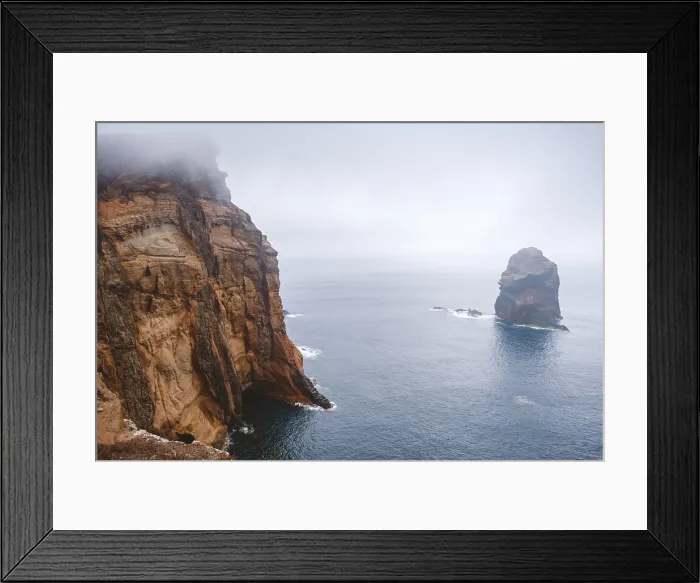 Framed Print : Foggy atmosphere at rocky shore of Madeira Island