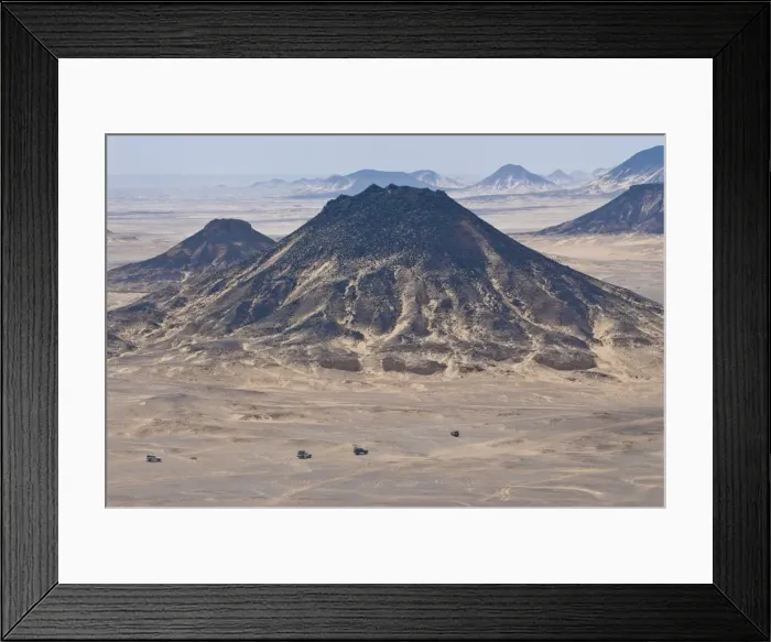 Framed Print : Jeeps passing little mountains in the Black Desert, Western Egypt, Egypt Framed Print : Jeeps passing little mountains in the Black Desert, Western Egypt, Egypt