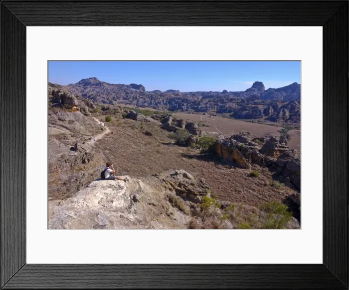 Framed Print : Tourist looking over the rock formations of the Isalo National Park, Madagascar, Africa Framed Print : Tourist looking over the rock formations of the Isalo National Park, Madagascar, Africa