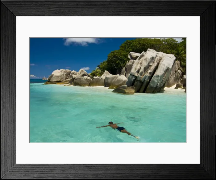 Framed Print : Local man swimming at the Granite rocks at Ile aux Cocos, Seychelles, Indian Ocean Framed Print : Local man swimming at the Granite rocks at Ile aux Cocos, Seychelles, Indian Ocean