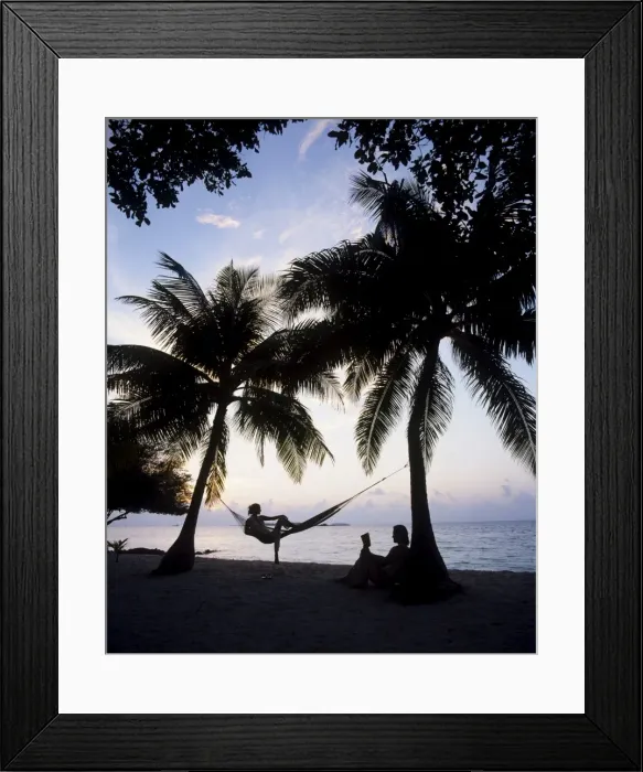 Framed Print : Couple relaxing on a beach at sunset, Maldives, Indian Ocean, Asia Framed Print : Couple relaxing on a beach at sunset, Maldives, Indian Ocean, Asia