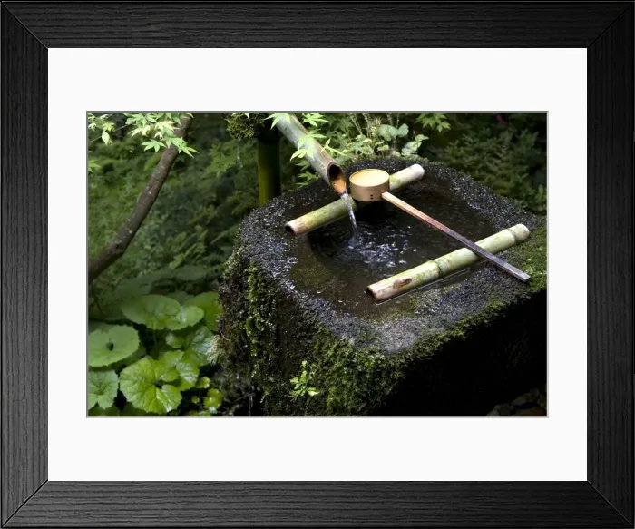 Framed Print : A tsukubai (stone water basin) with bamboo ladle in a garden at Sanzenin Temple in Ohara Framed Print : A tsukubai (stone water basin) with bamboo ladle in a garden at Sanzenin Temple in Ohara
