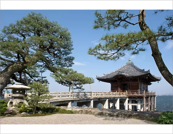 Picturesque Ukimido Temple pagoda resting on stilts above Lake Biwa in Otsu