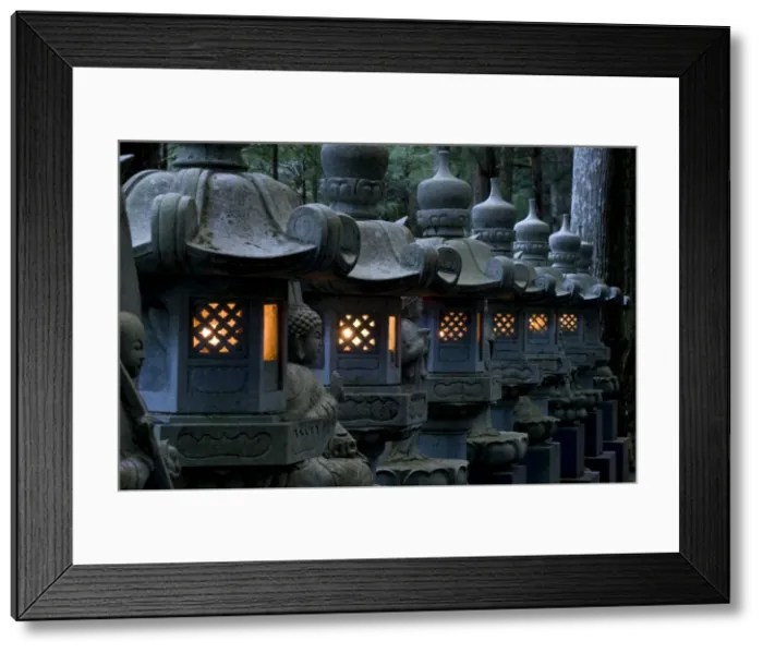 Framed Print : Row of lighted stone lanterns in the Okunoin Temple cemetery at Koyasan (Mount Koya) Framed Print : Row of lighted stone lanterns in the Okunoin Temple cemetery at Koyasan (Mount Koya)