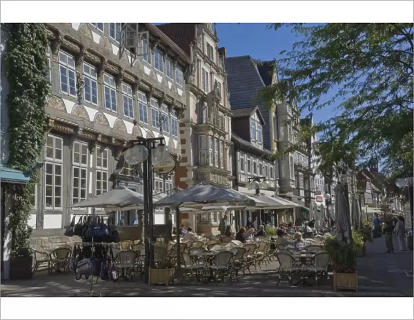 Medieval gables form a background to pavement cafes in Hamelin, Lower Saxony