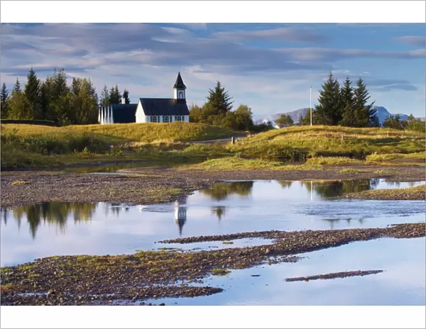 Thingvellir national church, built in 1859 on the site of Icelands first church constructed in 1000 AD, seen from Oxaraholmi, an island in the River Oxara, site of legal duelling in the past, Thingvellir National Park, UNESCO World