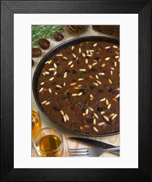 Framed Print : Castagnaccio, pie of chestnut flour with raisins, rosemary and pine nuts Framed Print : Castagnaccio, pie of chestnut flour with raisins, rosemary and pine nuts