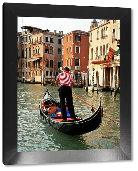 Evening picture of a gondolier on the Grand Canal, Venice, UNESCO World Heritage Site