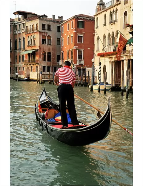 Evening picture of a gondolier on the Grand Canal, Venice, UNESCO World Heritage Site