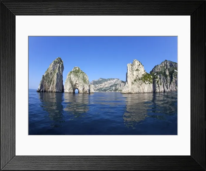 Framed Print : Faraglioni Rocks taken from the sea in early morning summer sunshine, Isle of Capri Framed Print : Faraglioni Rocks taken from the sea in early morning summer sunshine, Isle of Capri