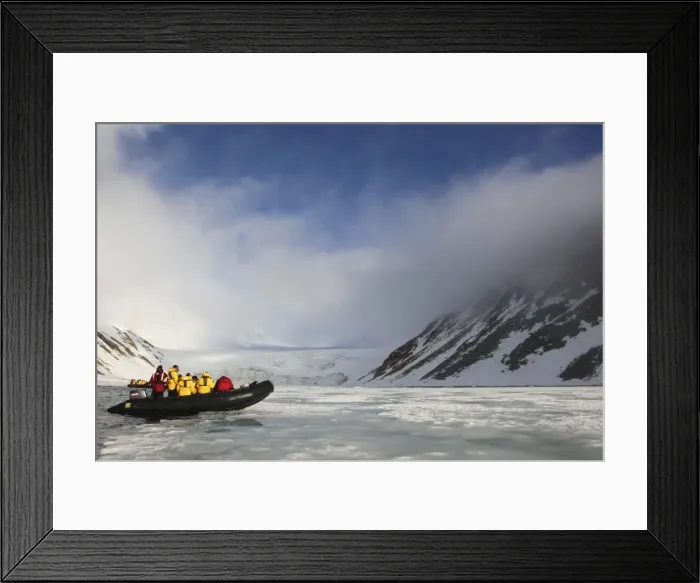 Framed Print : Zodiac inflatable with tourists exploring Arctic landscape in summer sunshine Framed Print : Zodiac inflatable with tourists exploring Arctic landscape in summer sunshine
