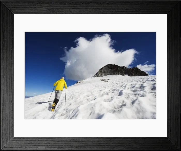Framed Print : A climber walking up a snowfield, Pico de Aneto, at 3404m the highest peak in the Pyrenees Framed Print : A climber walking up a snowfield, Pico de Aneto, at 3404m the highest peak in the Pyrenees