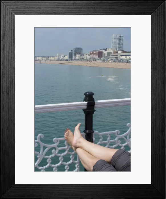 Framed Print : Foot sunbathing on the pier, Brighton, Sussex, England, United Kingdom, Europe Framed Print : Foot sunbathing on the pier, Brighton, Sussex, England, United Kingdom, Europe