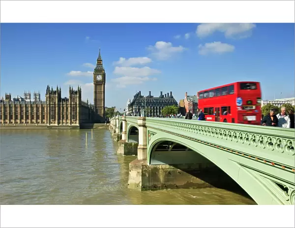 Red London bus crossing Westiminster Bridge, London, England, United Kingdom, Europe