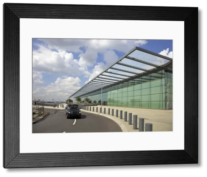 Framed Print : Black taxi cab drives away from Terminal 4, Heathrow Airport, London, England Framed Print : Black taxi cab drives away from Terminal 4, Heathrow Airport, London, England