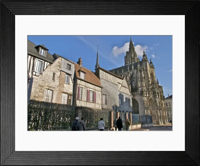Framed Print : The west facade of the 15th century Notre Dame church, houses and tourists Framed Print : The west facade of the 15th century Notre Dame church, houses and tourists
