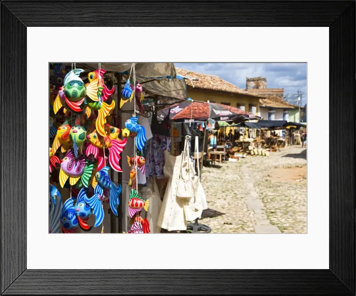 Framed Print : A display of colourful wooden fish for sale in a craft market in Trinidad Framed Print : A display of colourful wooden fish for sale in a craft market in Trinidad