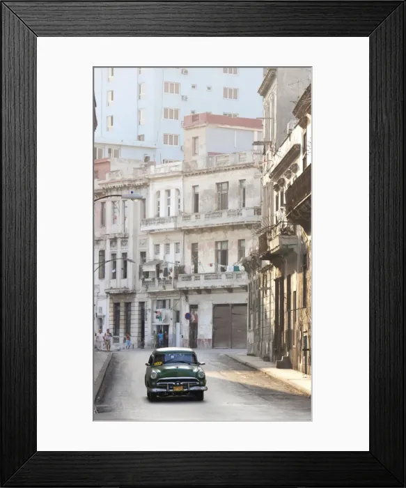 Framed Print : Classic American car taxi driving down quiet street in Havana Centro, Havana Framed Print : Classic American car taxi driving down quiet street in Havana Centro, Havana