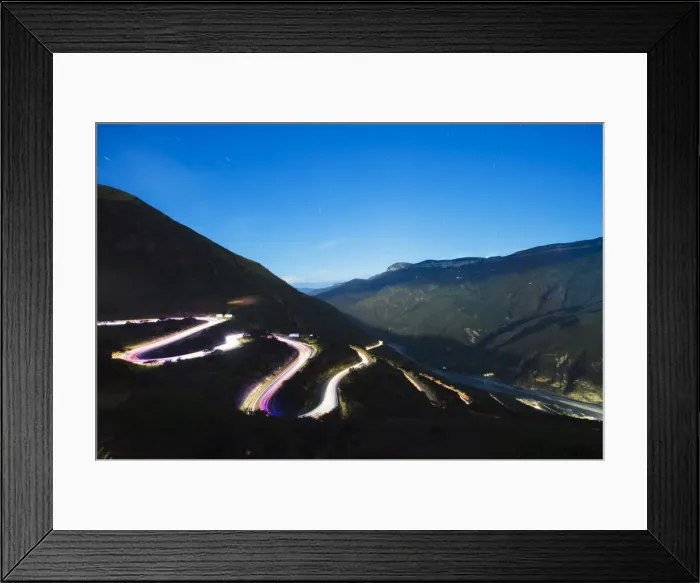 Framed Print : Moonlit valley and car light trails on a winding road in Chicamocha National Park Framed Print : Moonlit valley and car light trails on a winding road in Chicamocha National Park