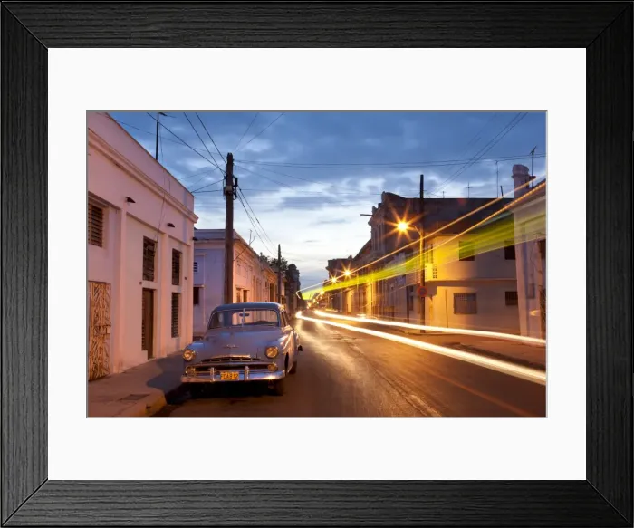 Framed Print : Street scene at night showing Classic American car and the light trails of passing traffic Framed Print : Street scene at night showing Classic American car and the light trails of passing traffic